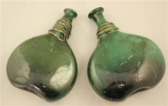 Two Persian green glass saddle flasks, 18th / 19th century, 23cm.
